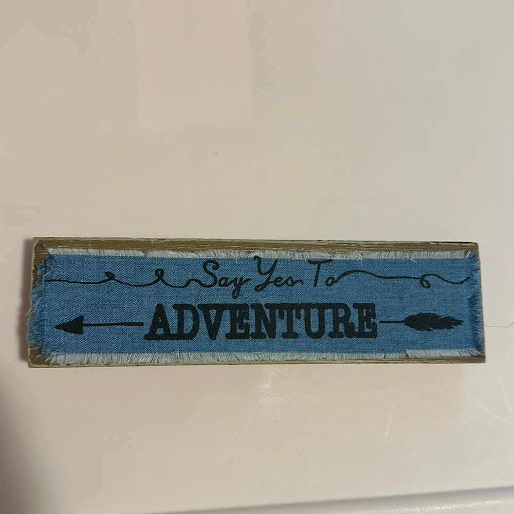 “Say Yes To Adventure” sign